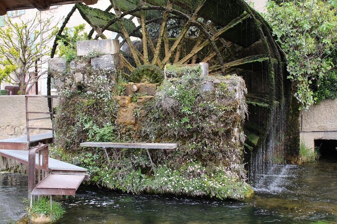 A day in Provence: Les Baux de Provence, Saint Rémy and more - Isle-sur-la-Sorgue: antiques, working water wheels, and waterside cafés